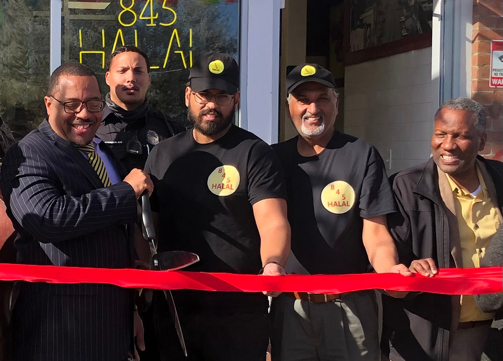 At the Grand Opening of 845 Halal (l. - r.) Mayor Torrance Harvey, Aaqib Majeed, Rafiq Majeed and Councilman Anthony Grice.